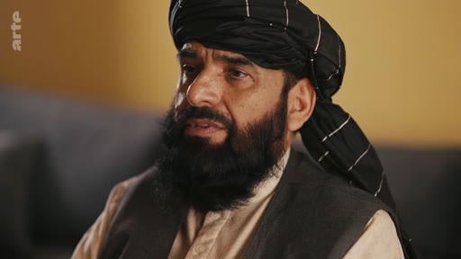 Un homme barbu portant un turban traditionnel est filmé en gros plan lors d'une interview télévisée. Il s'agit d'une séquence issue d'un reportage de la chaîne Arte.