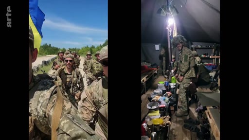 Des soldats ukrainiens en uniforme de camouflage sont filmés lors d'une séquence montrant leur quotidien, incluant des exercices en extérieur et des moments de repos dans une tente aménagée. La vidéo illustre la vie des troupes ukrainiennes sur le terrain.